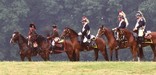 Dragoon reenactors sitting atop their horses overlook Valley Forge NHP.
